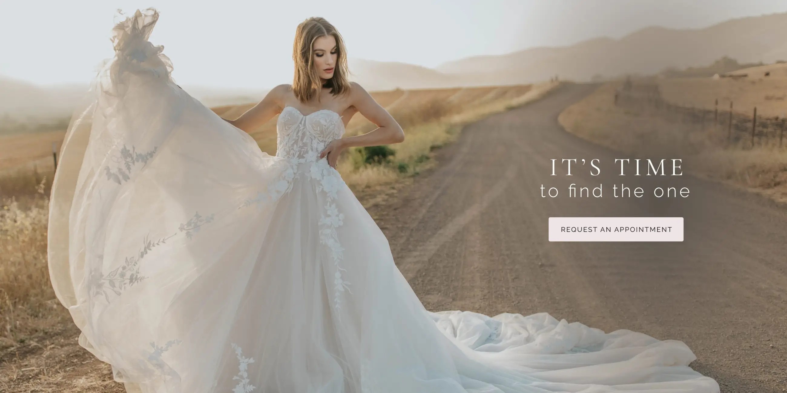 Model wearing lace white wedding gown