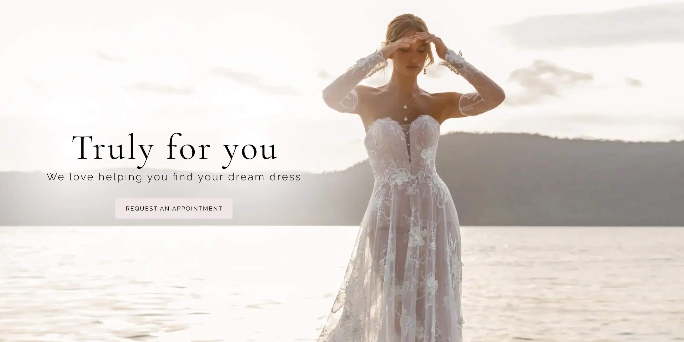 Model wearing lace white wedding gown