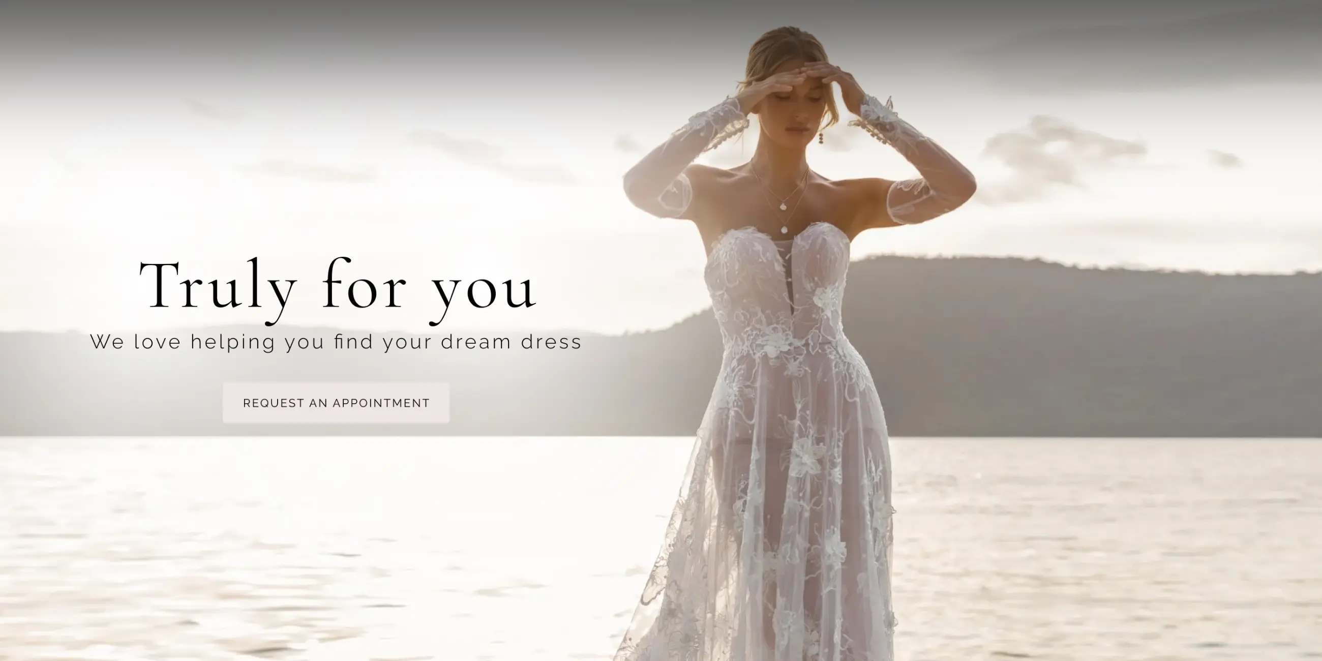 Model wearing lace white wedding gown