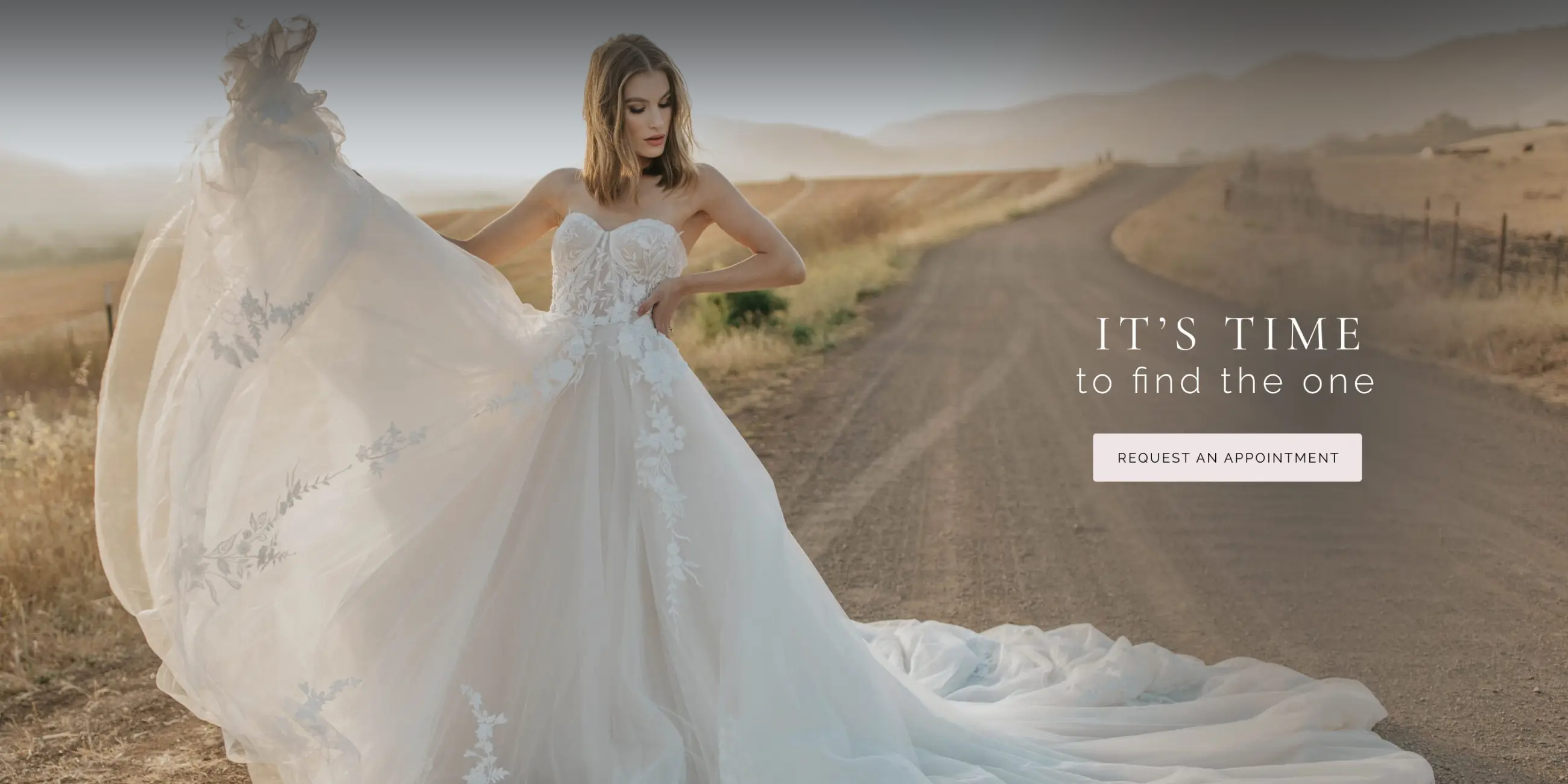 Model wearing lace white wedding gown